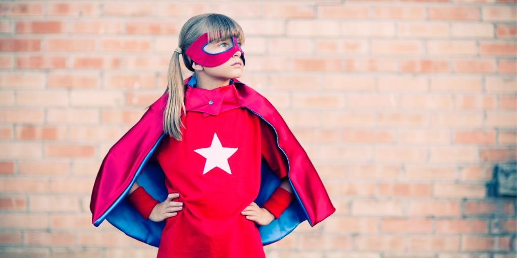 Girl wearing superhero costume 