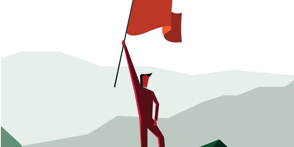 A man raise the flag as a sign