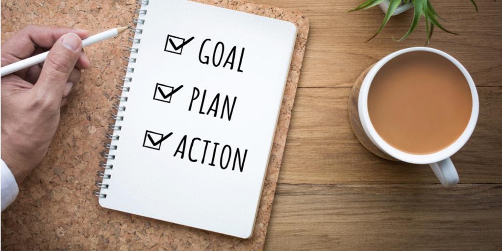 journal with checklist that reads goal, plan, action