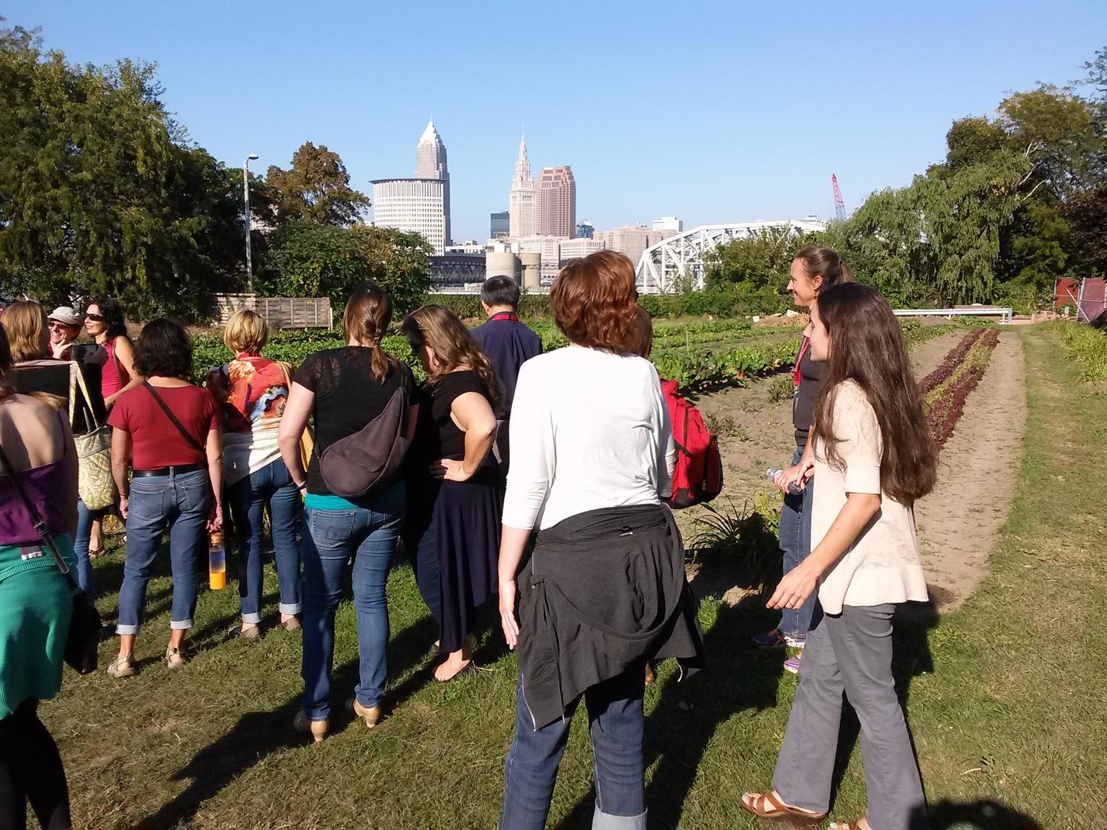 educators and community members touring a successful urban farm