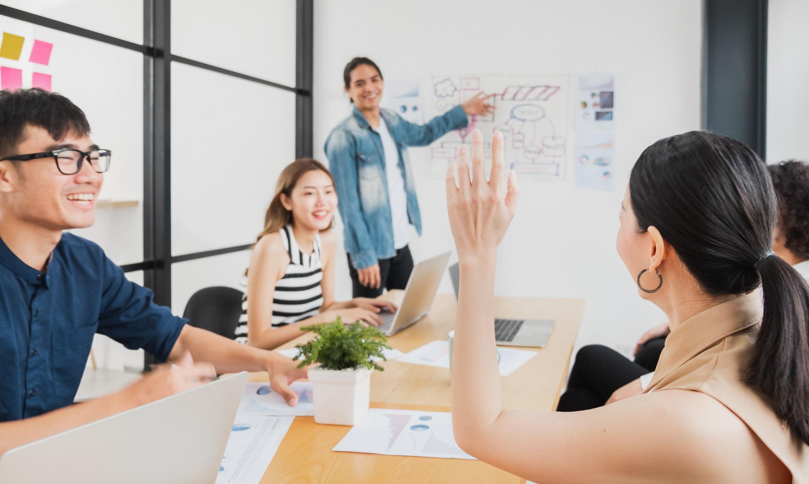 Employee ask a question in the meeting