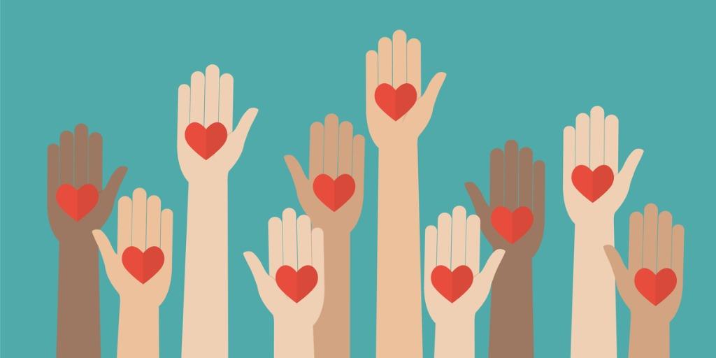 some hands volunteering raised up