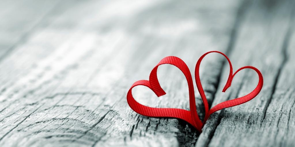 red ribbons making the shape of two hearts