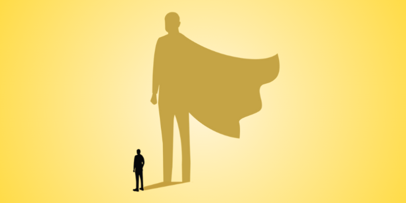 person whose shadow silhouette is a superhero