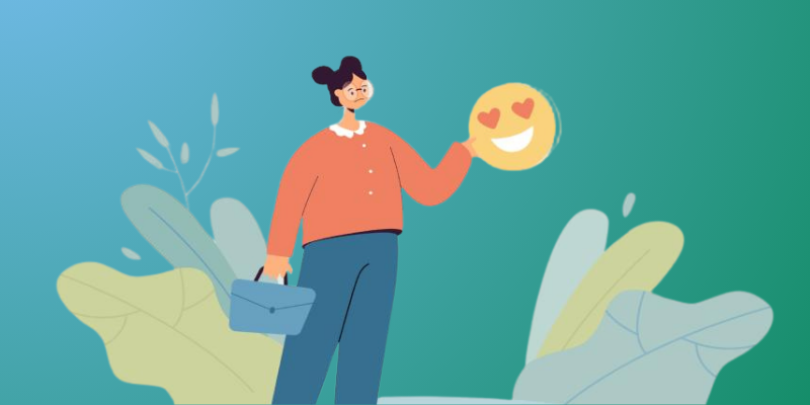 Sad woman holding a smiling emoticon