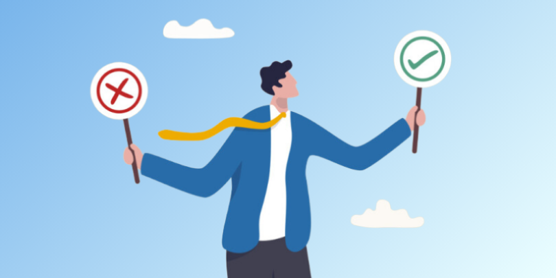 man holding one sign with an X and another sign with a checkmark