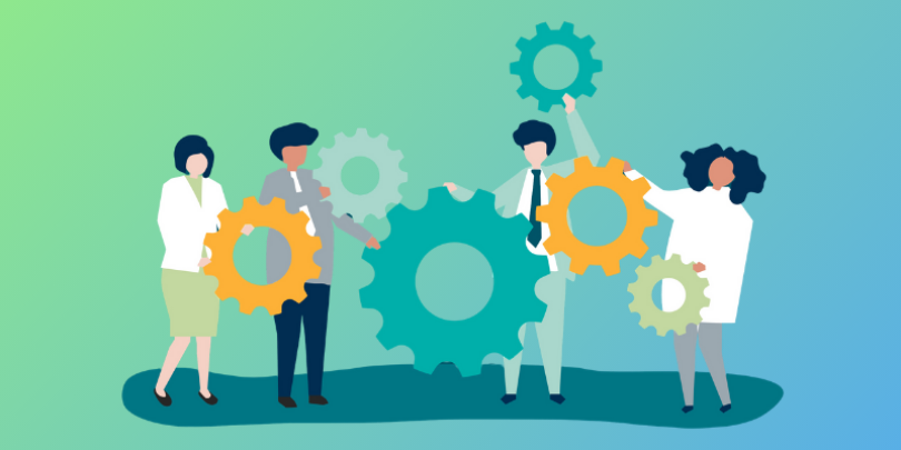 4 employees holding gears together