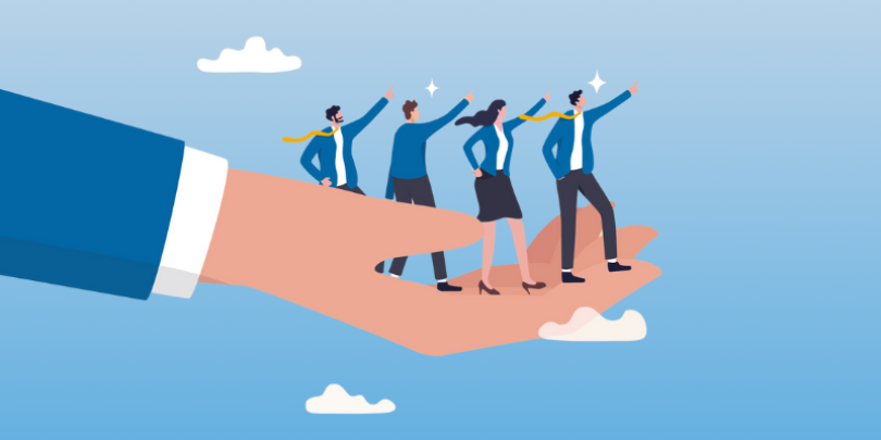 boss' hand holding 4 aspiring employees to represent guiding/helping them