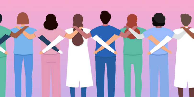 group of healthcare workers with arms linked