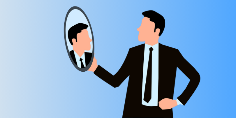 Man looking into a mirror
