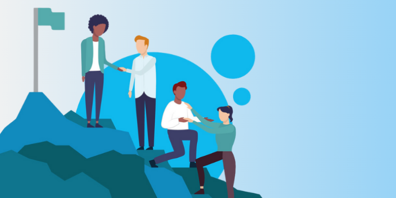 4 employees helping each other climb a mountain