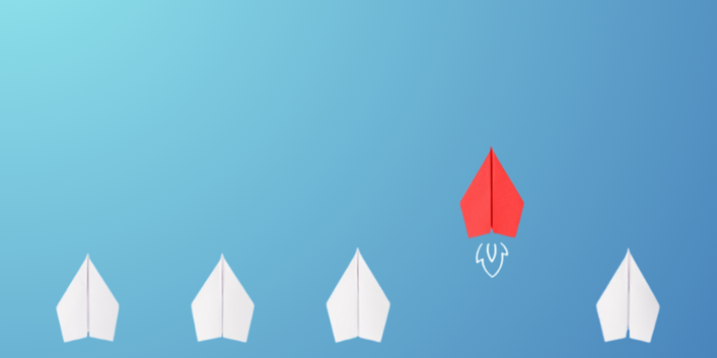4 white and 1 red paper airplaines