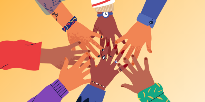 diverse group of hands high five