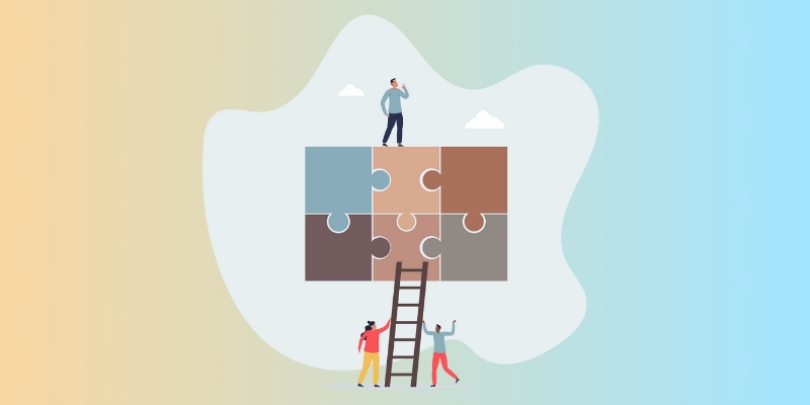 employees completing a puzzle together