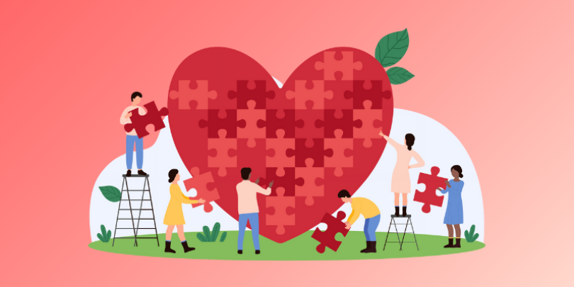 people building a puzzle in the shape of a heart