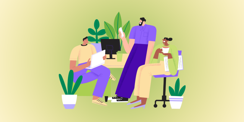 3 employees smiling and chatting