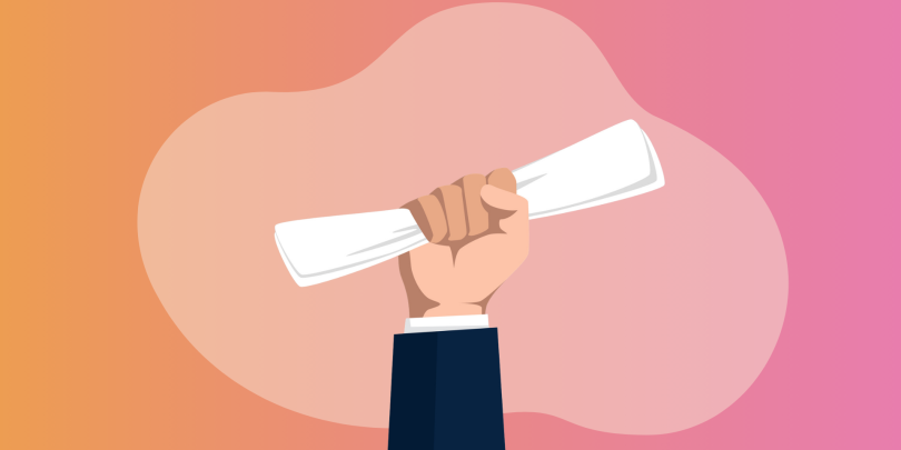 hand holding a degree