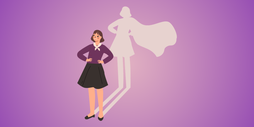 woman standing confidently and her shadow is a superhero
