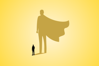 person whose shadow silhouette is a superhero