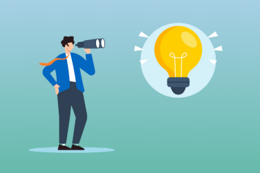 man looking through telescope at lightbulb