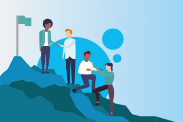 4 employees helping each other climb a mountain