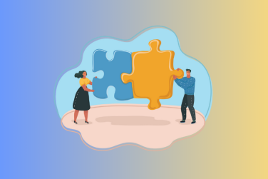 man and woman holding 2 puzzle pieces together tp show teamwork