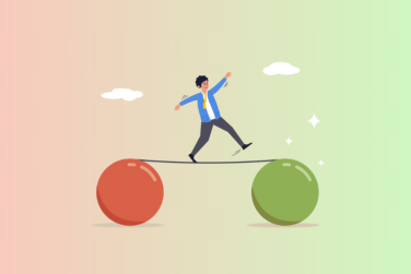 balancing on a stick that is supported by red and green balls