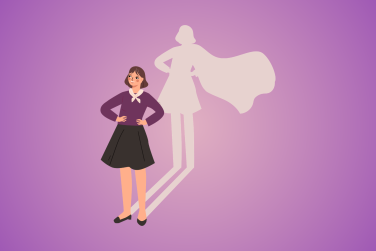 woman standing confidently and her shadow is a superhero