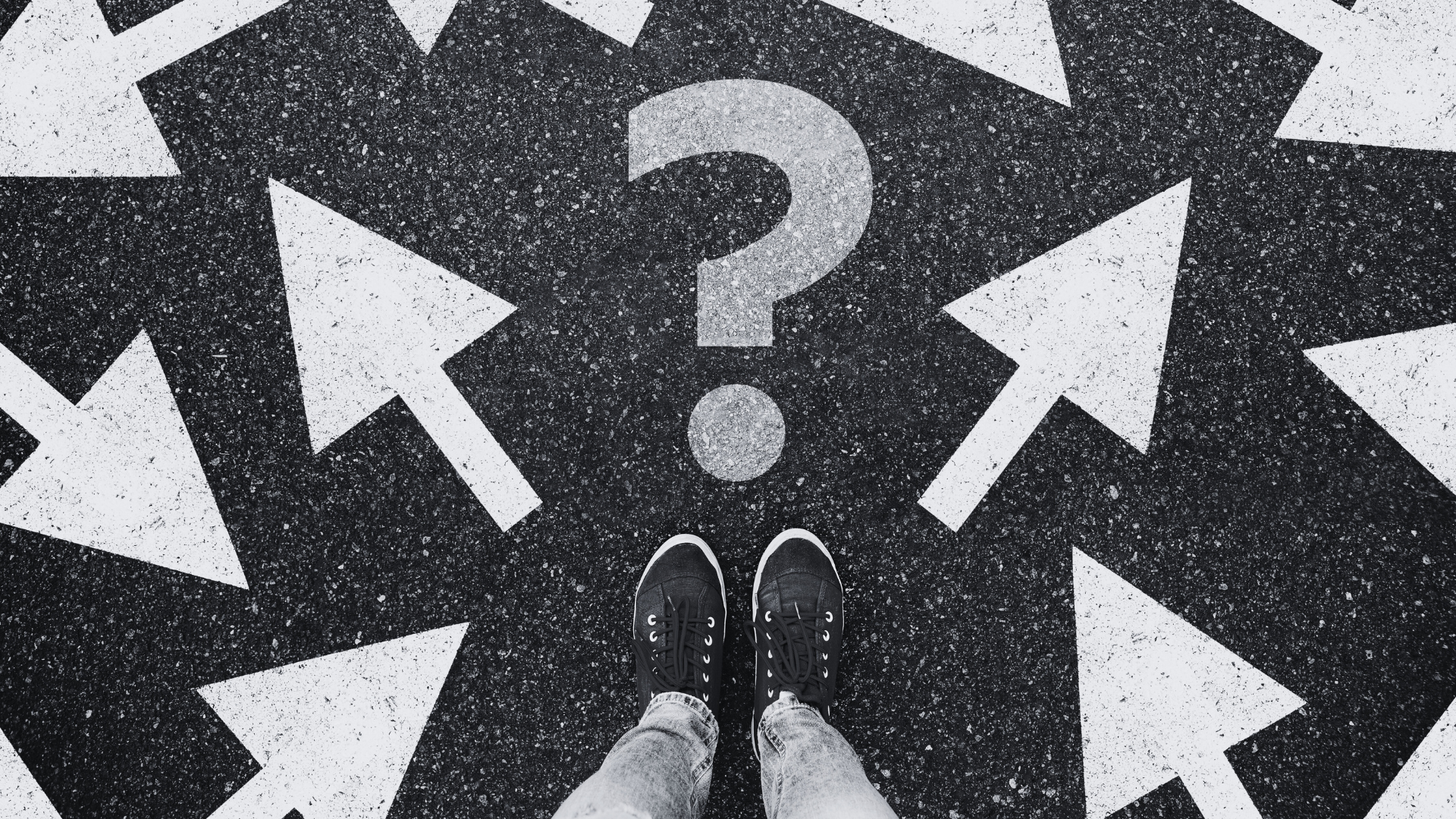 Question mark with arrows pointing in separate directions