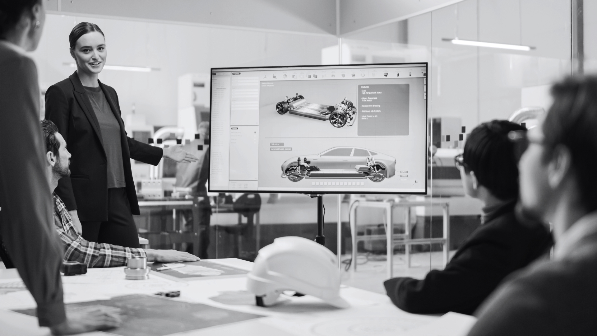 Woman presenting at a product development meeting