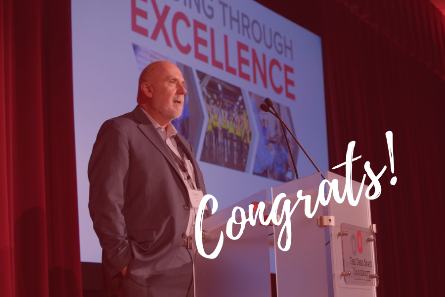 Peter Ward presenting at a podium with Congrats text overlay