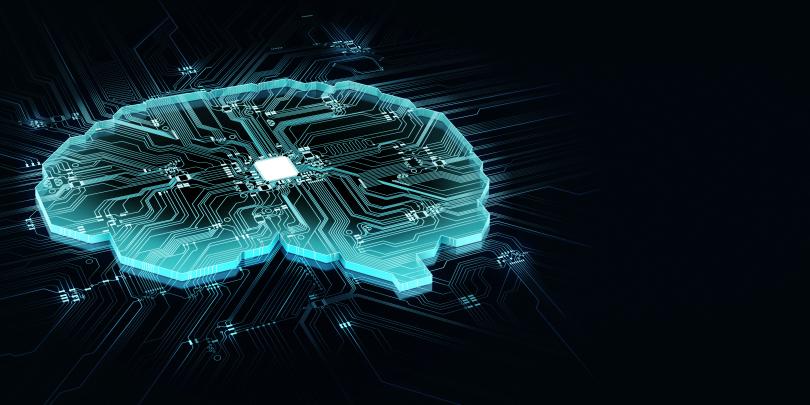 Glowing blue brain with computer chip