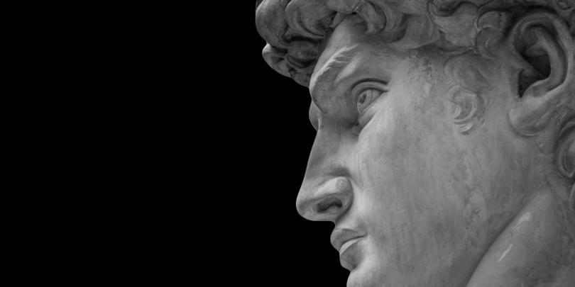 Side profile of marble sculpture with black background