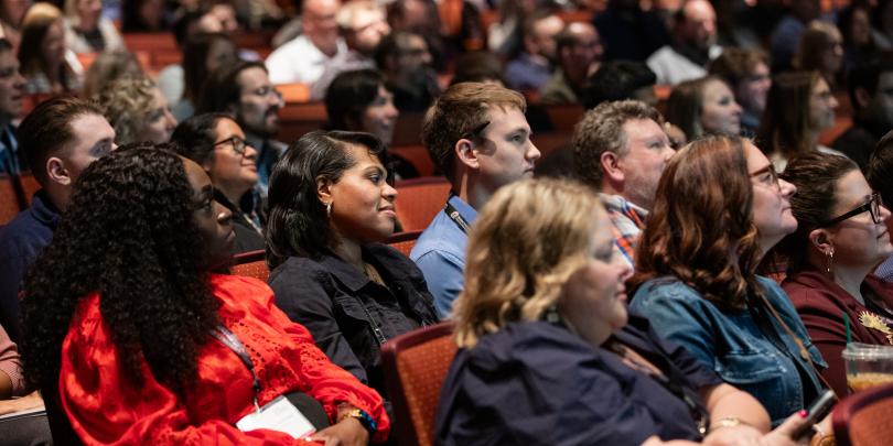 Audience seated in theater style seating at COE Summit 2026