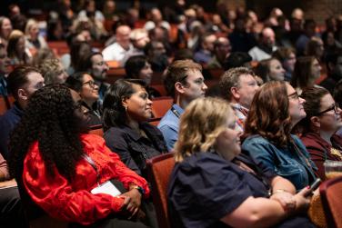 Audience seated in theater style seating at COE Summit 2026