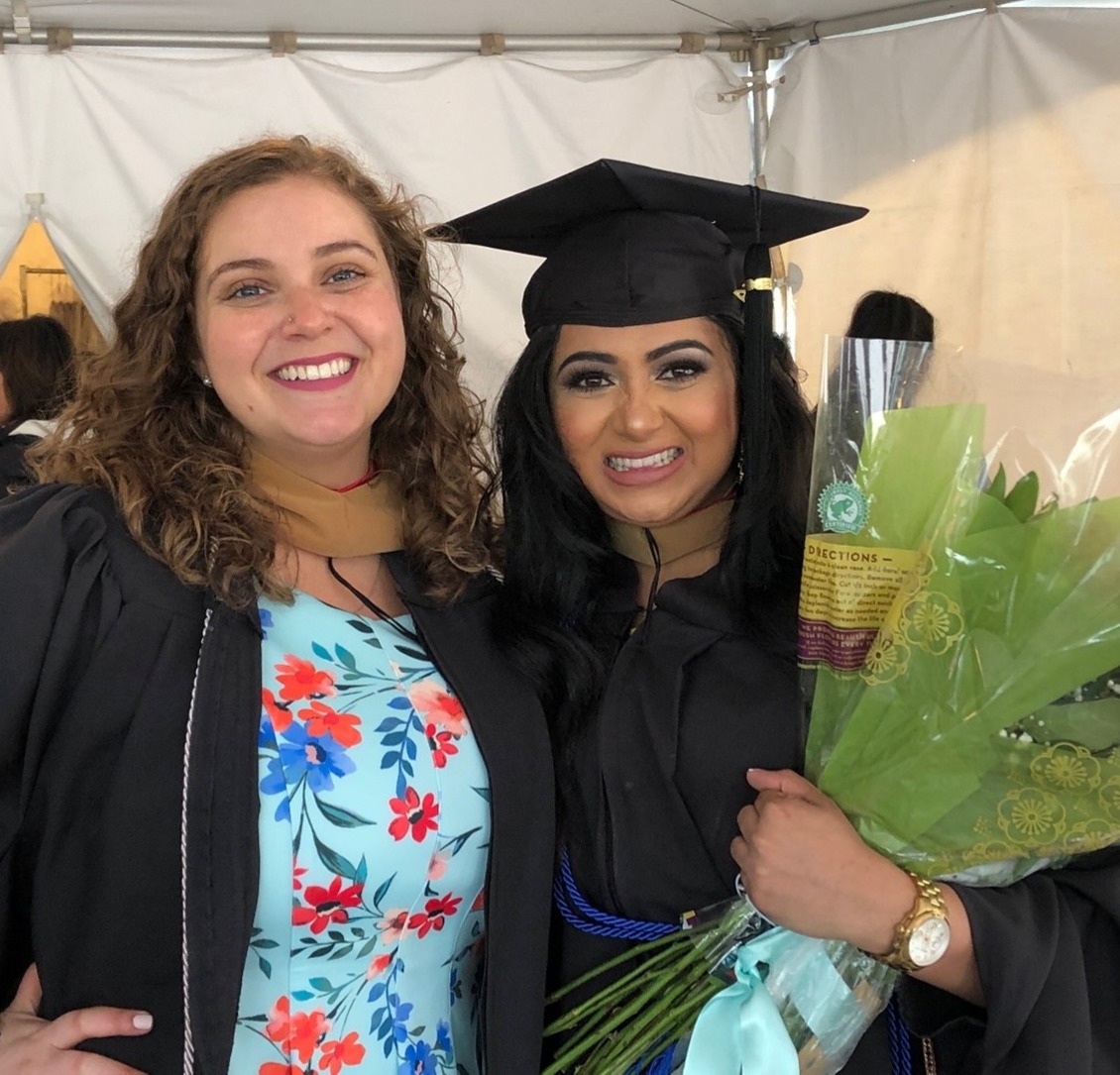 Neethi Johnson, right, in her cap and gown and posing with classmate Kaitlyn Kendall-Sperry at graduation. 