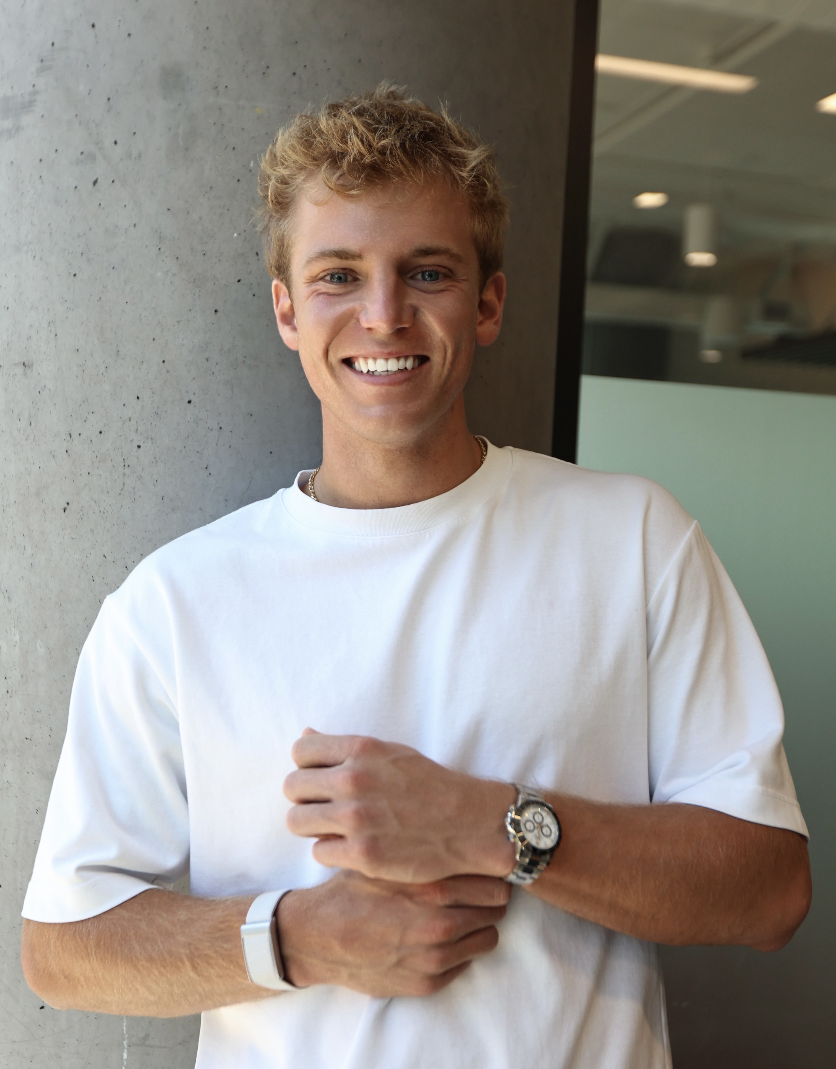 Nicolas Meader in a white shirt and smiling.