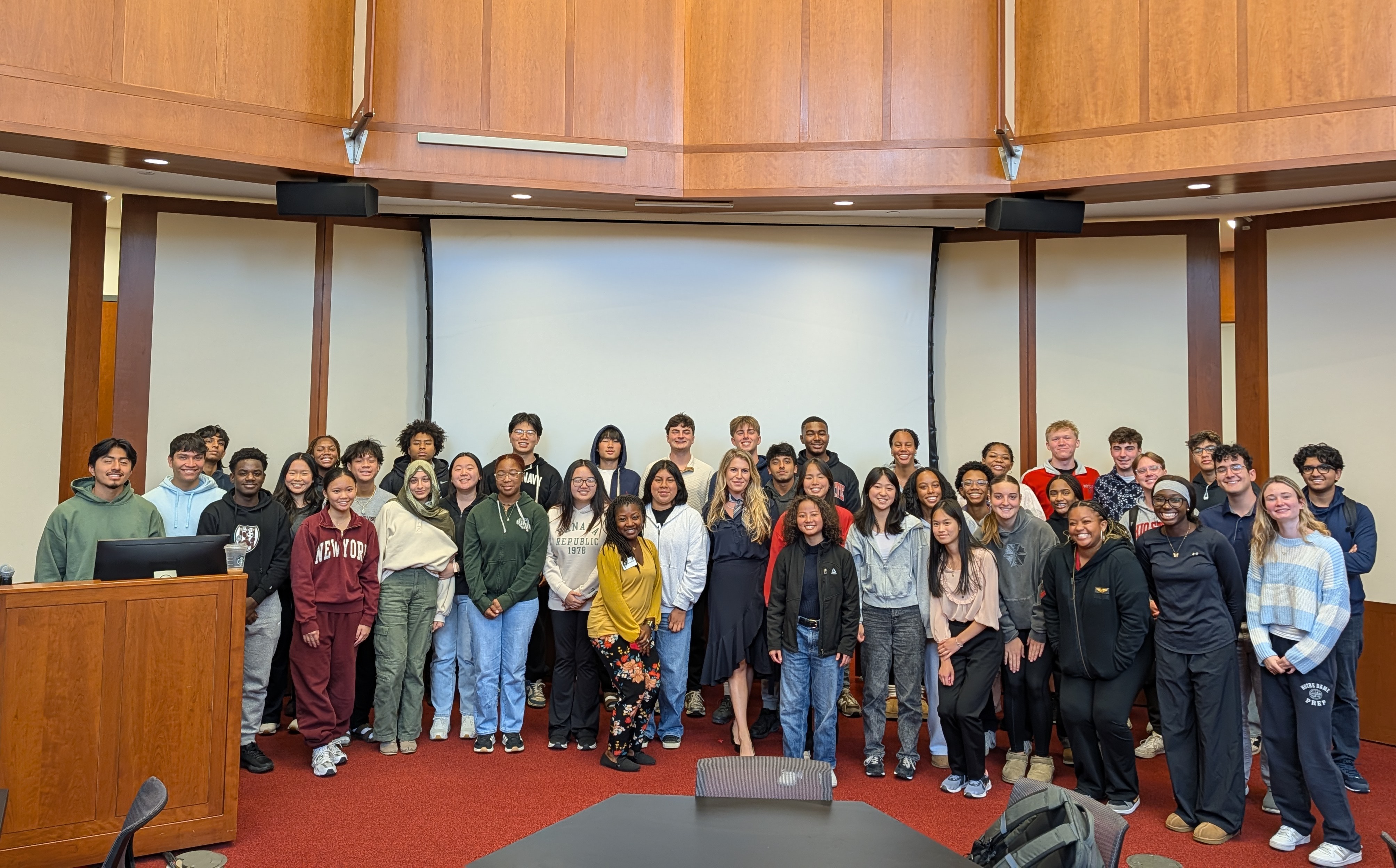 Sophia Mullins is surrounded by students in a lecture hall on the Fisher campus.