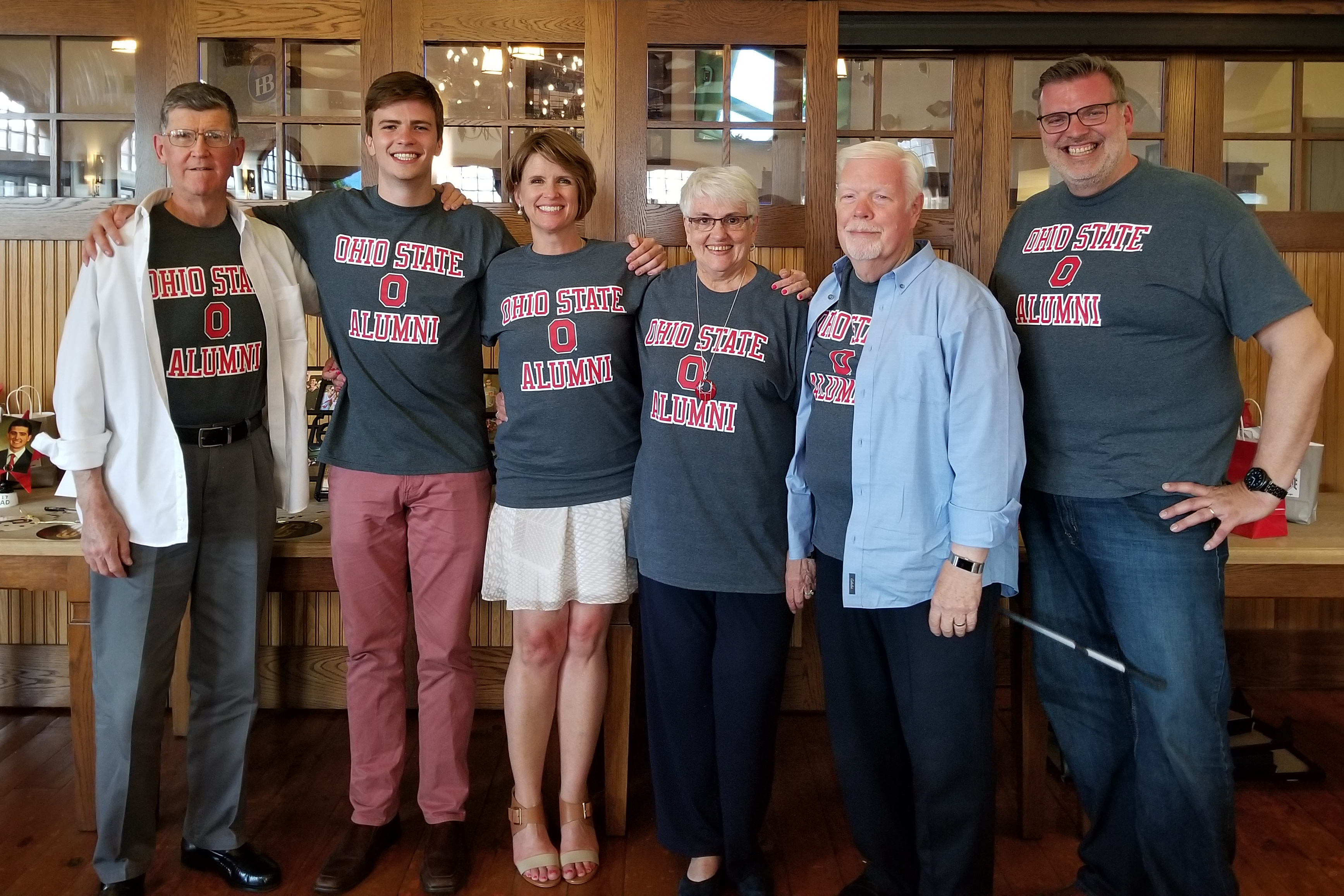 Melinda, third from left, with members of her family all wearing gray and red tee shirts with the words Ohio State alumni. In the photo are the late Bill Beuth Sr., Zachary Whittington, Susan Whittington, Arthur Whittington and Steve Whittington.