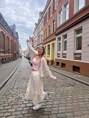 Maya Harvey on a cobblestone street in Germany.