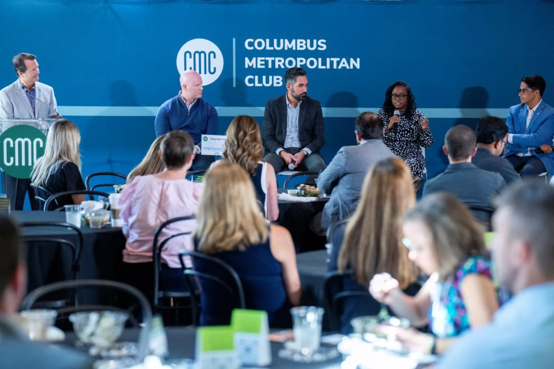 Speakers participate in a panel discussion about AI at the Columbus Metropolitan Club.