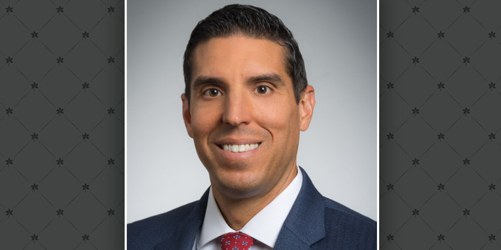 Headshot of Andy Noll on a gray buckeye leaves pattern background.
