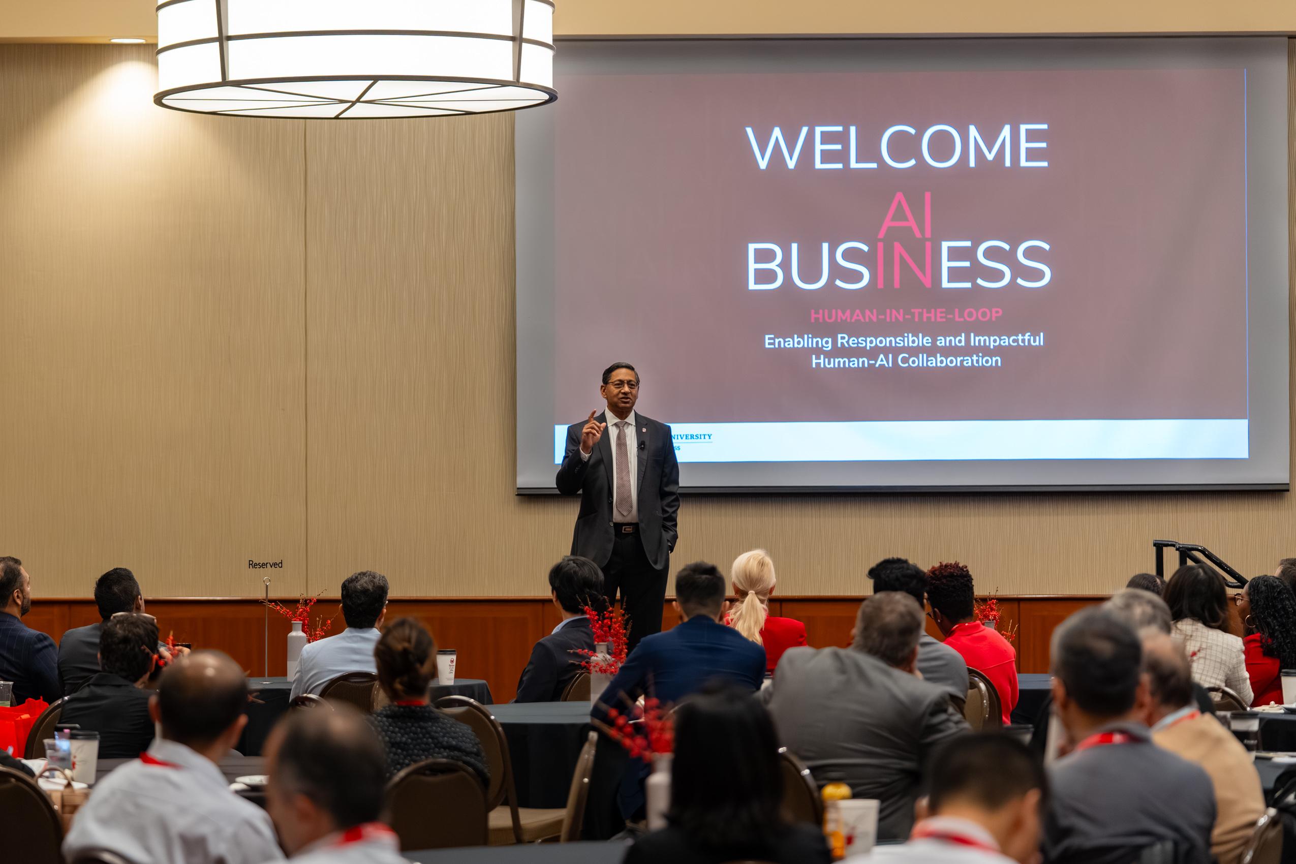 Provost Ravi Bellamkonda delivers welcome remarks at the AI in Business Conference