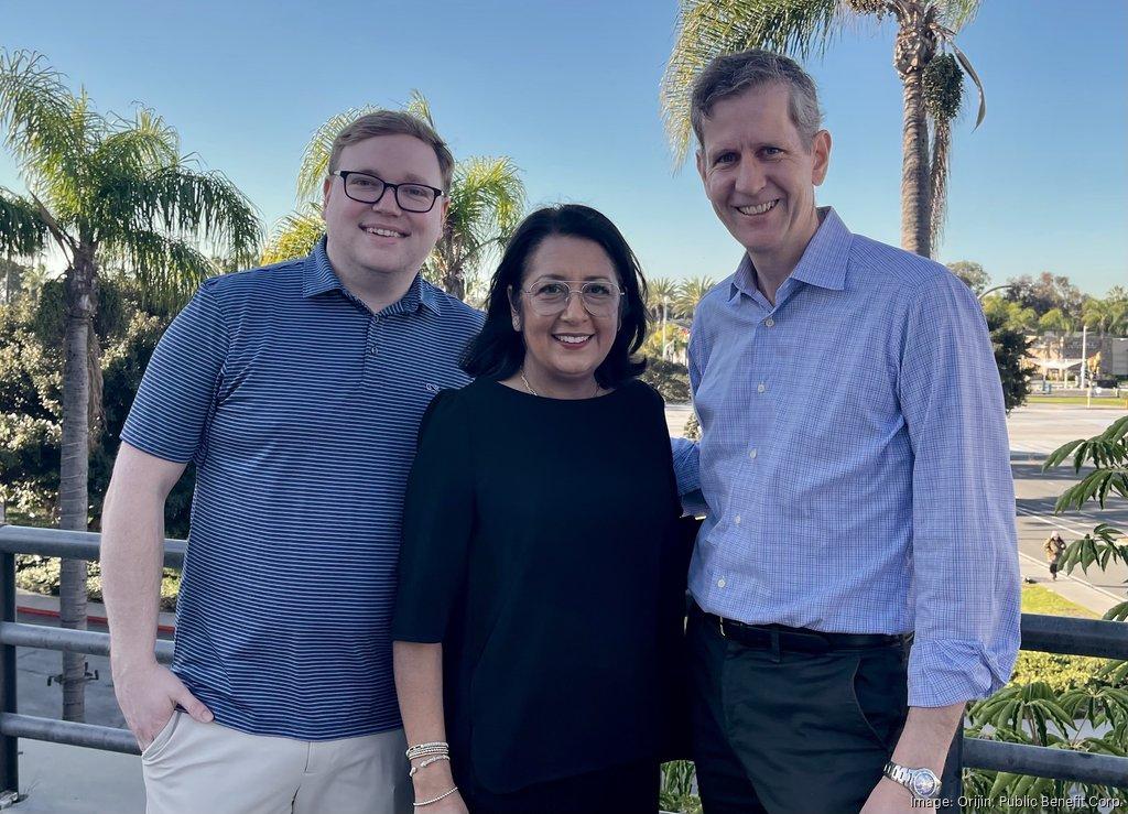 Honest Jobs founder Harley Blakeman, Orijin co-founder and Chief Strategy Officer Arti Finn and CEO Harris Ferrellstand together on an outdoor balcony with palm trees and a sunny street in the background.