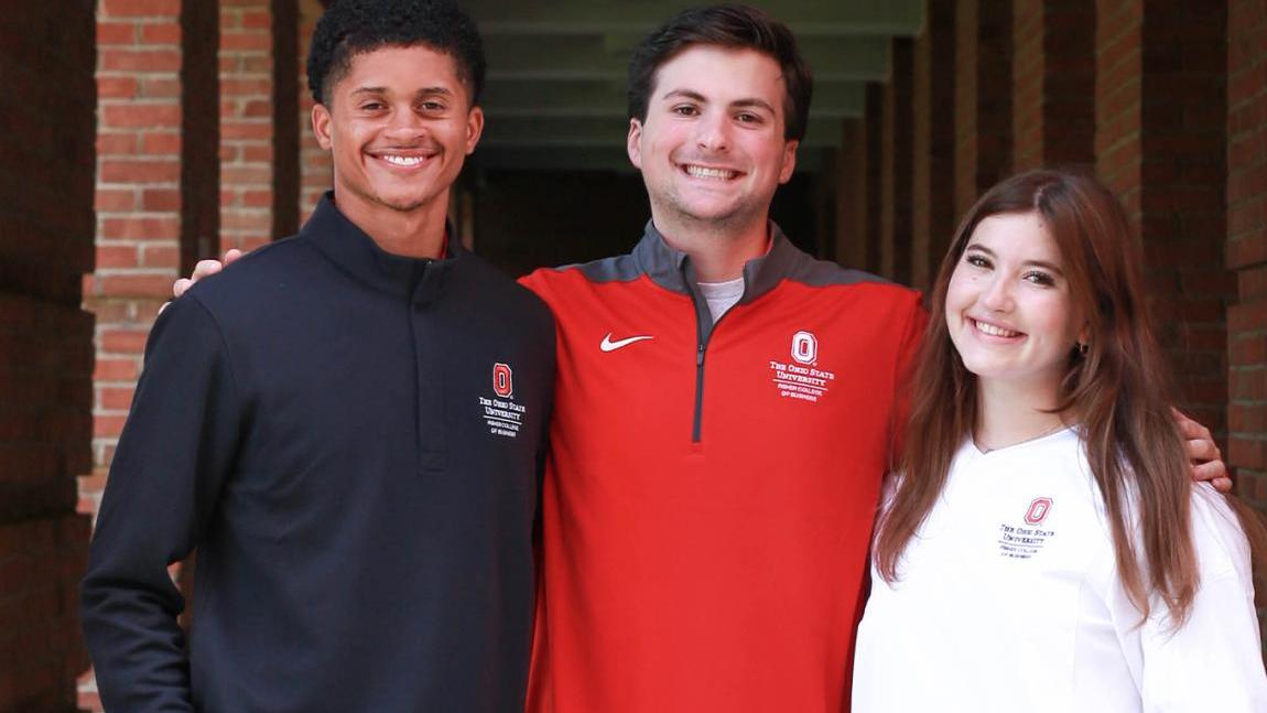 Smiling Fisher students standing next to each other.