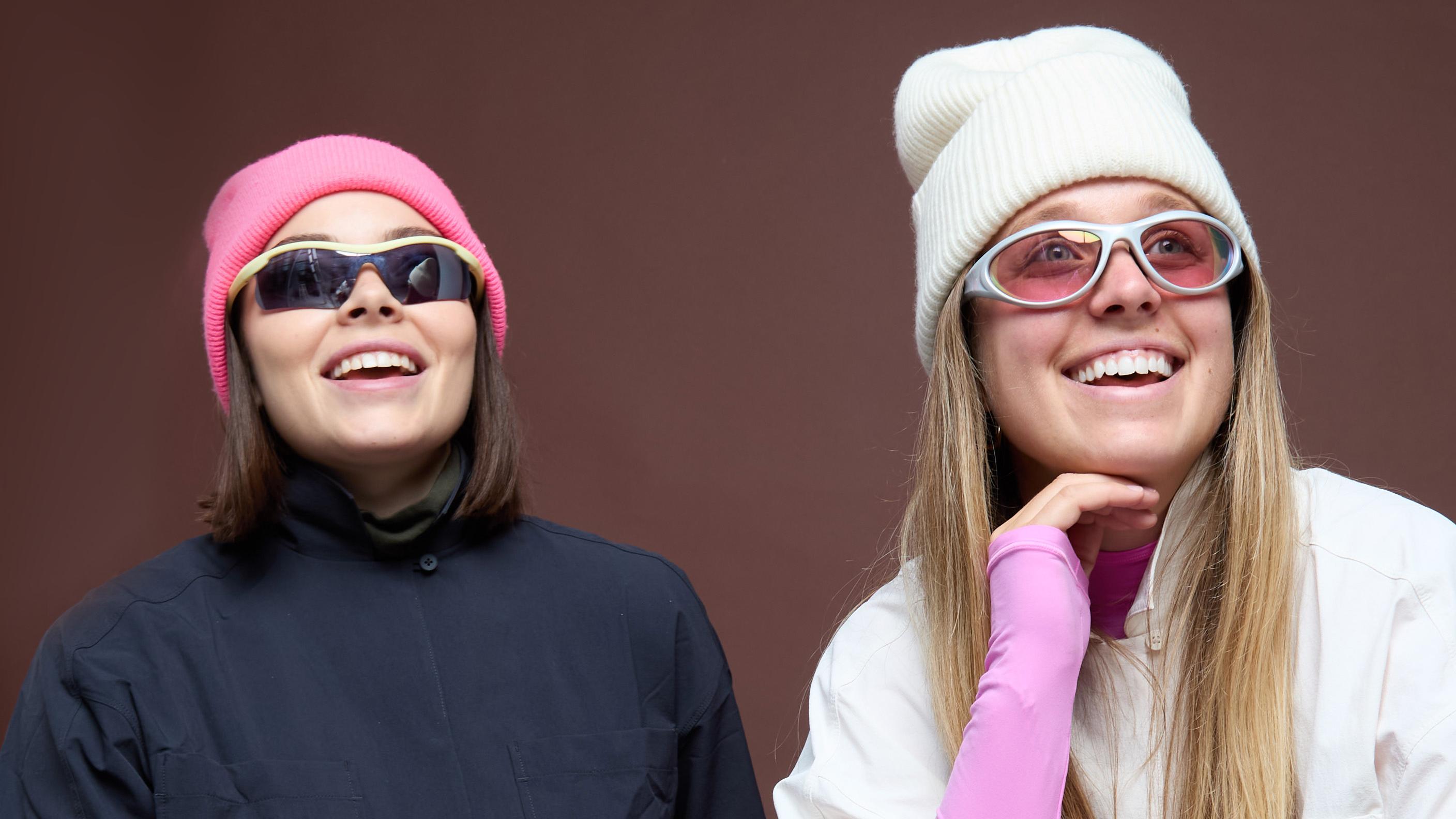 Madison Hilson and Valentina Thompson are pictured left to right wearing knit caps and sunglasses.