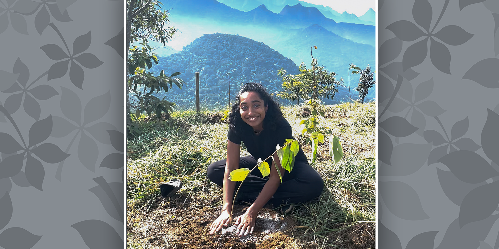 Safa Mohamed sitting on the ground planting a sappling at Sinal do Vale in Brazil.
