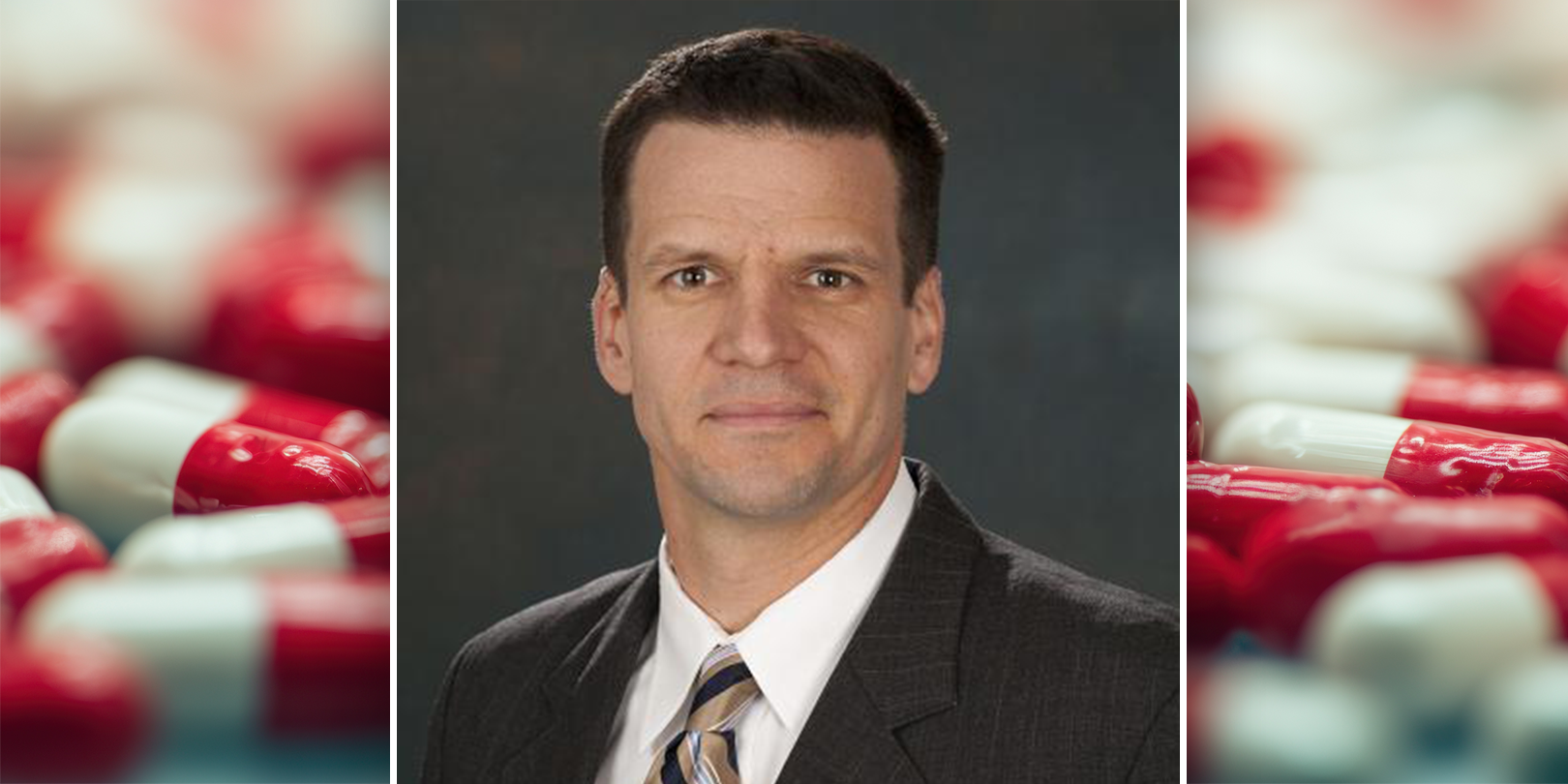 Headshot of John Gray with sidebar image of red and white pills