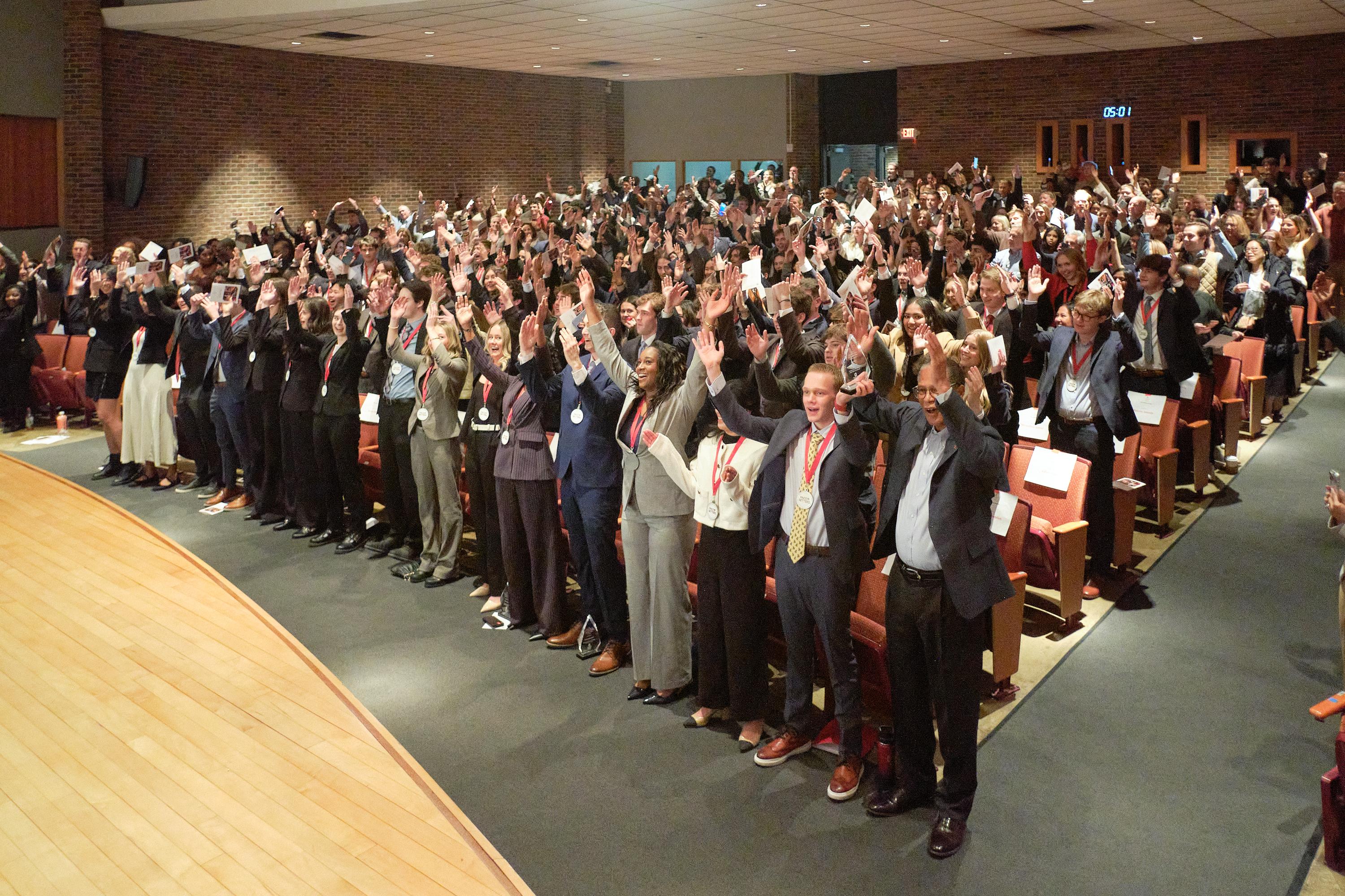 Two hundred audience members in auditorium spelling out O-H-I-O with their arms