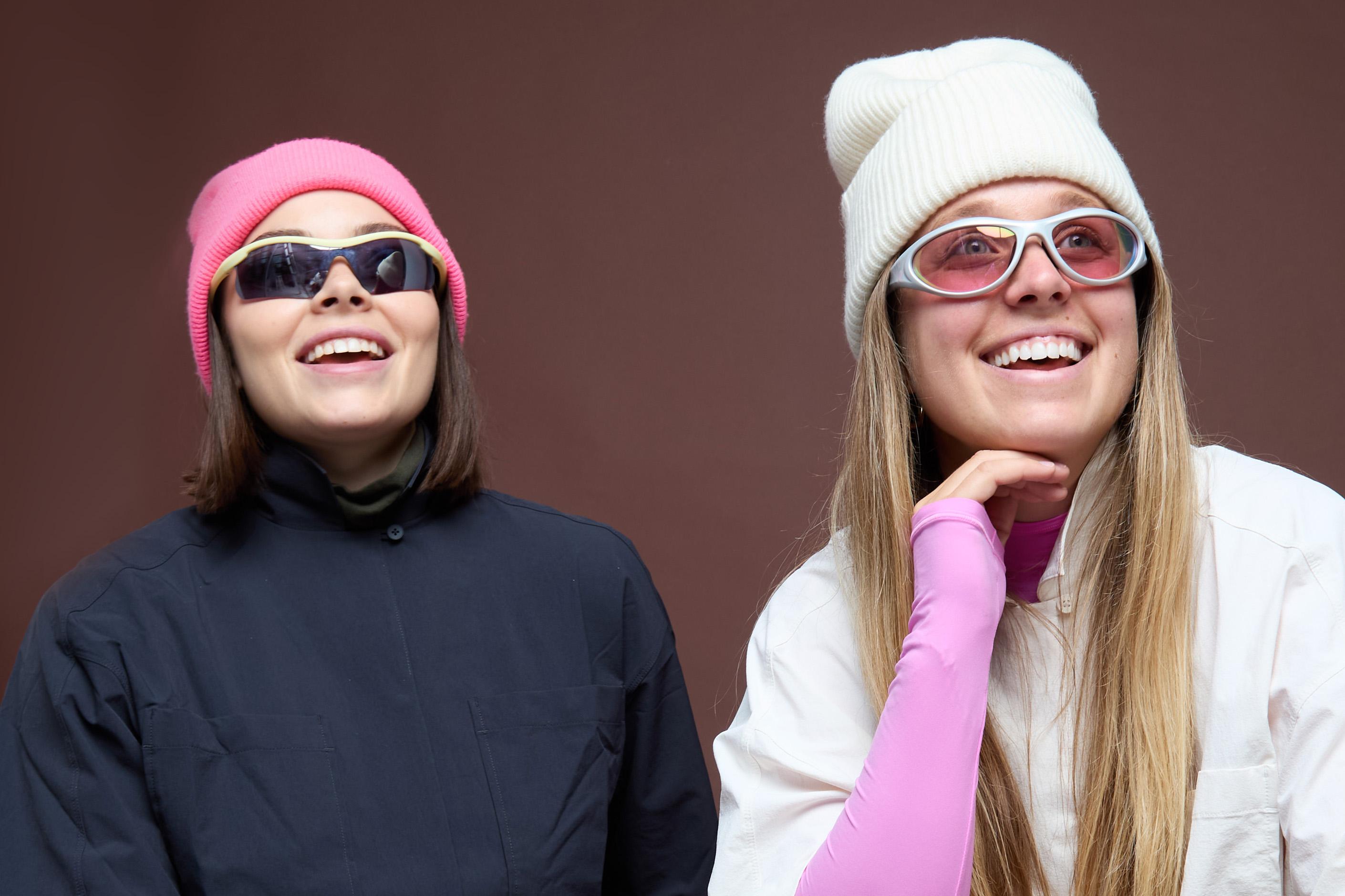 Madison Hilson and Valentina Thompson are pictured left to right wearing knit caps and sunglasses.